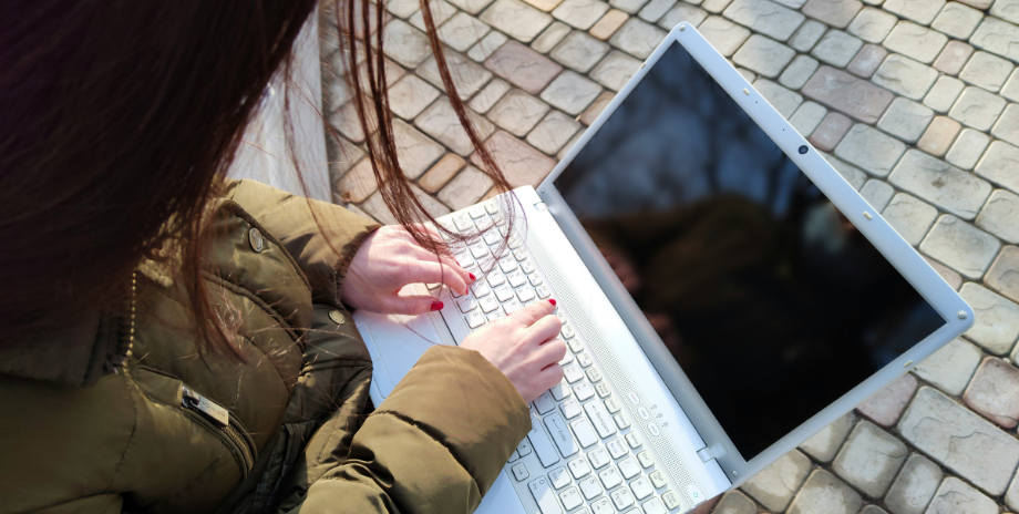 Young person with a laptop